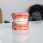orange plastic container on white table
